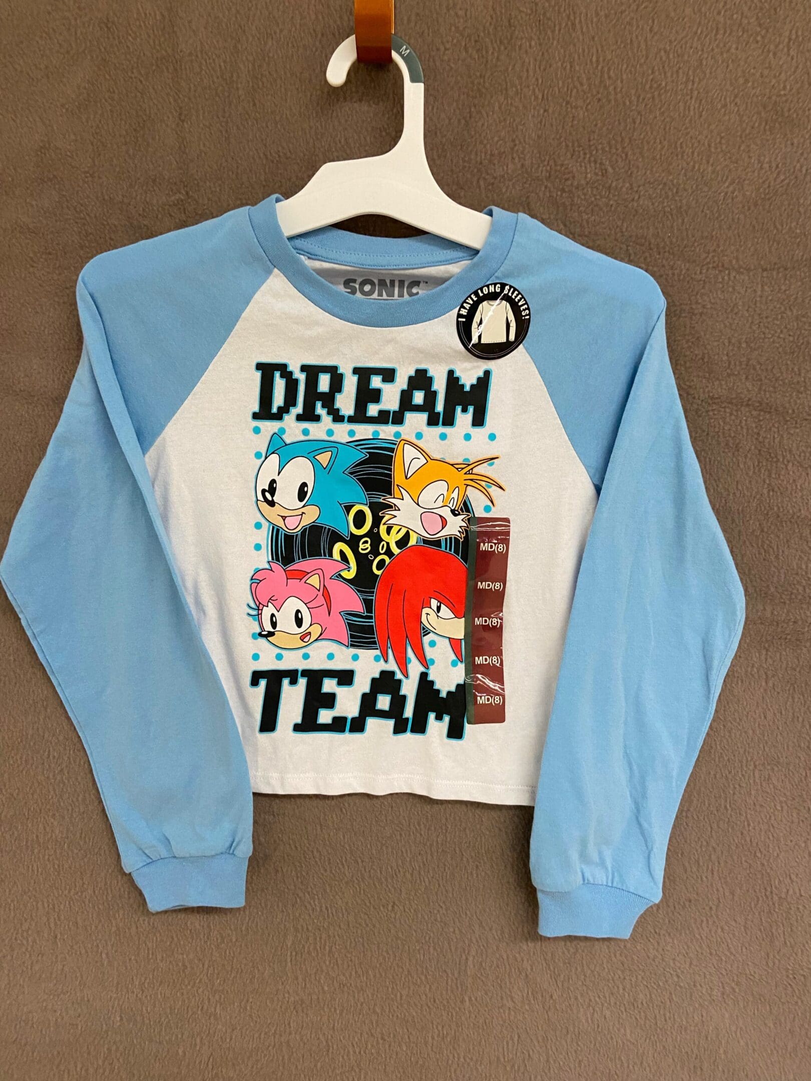 A blue and white shirt with cartoon characters on it.