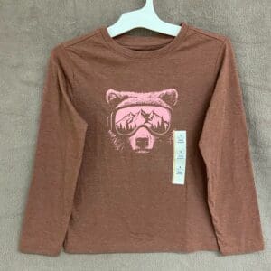 A brown long sleeve shirt with a pink bear on it.